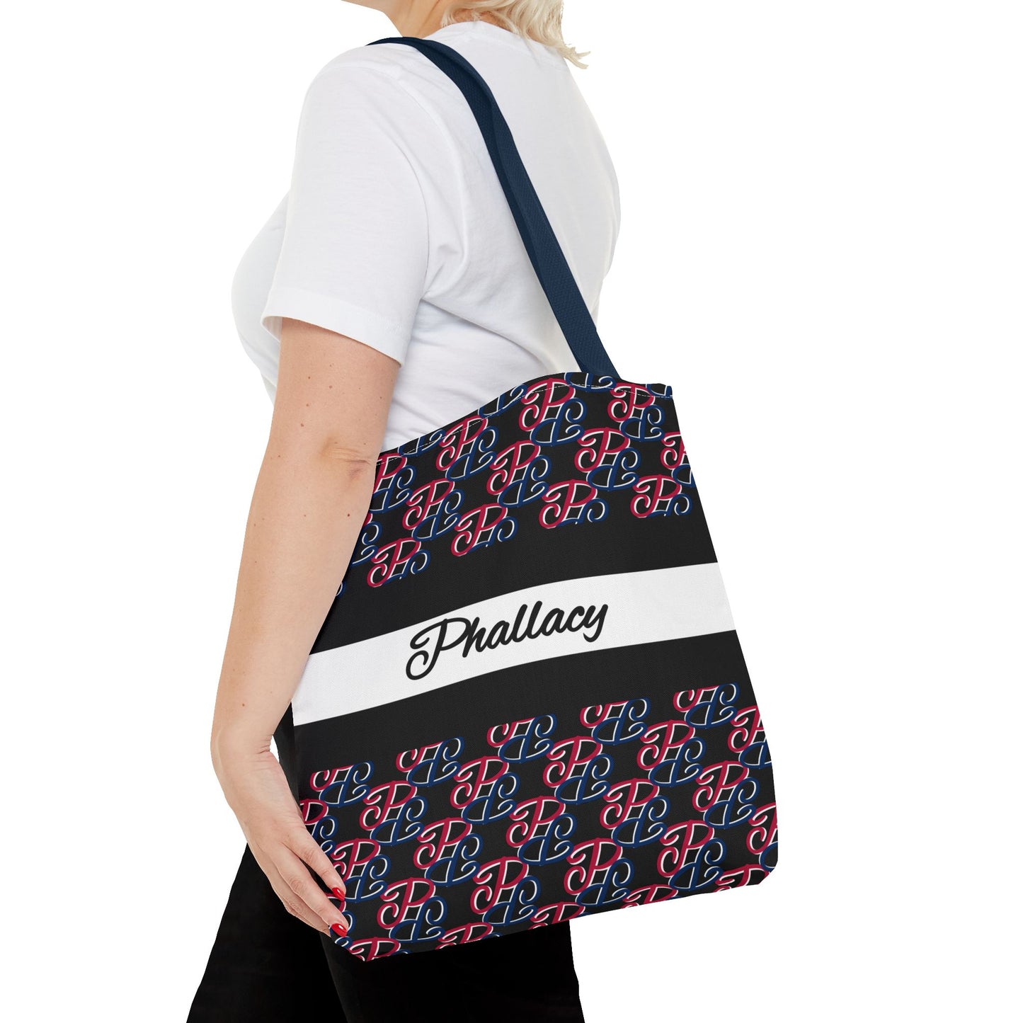 Phallacy black designer tote bag with red and blue pattern and Phallacy logo worn on shoulder