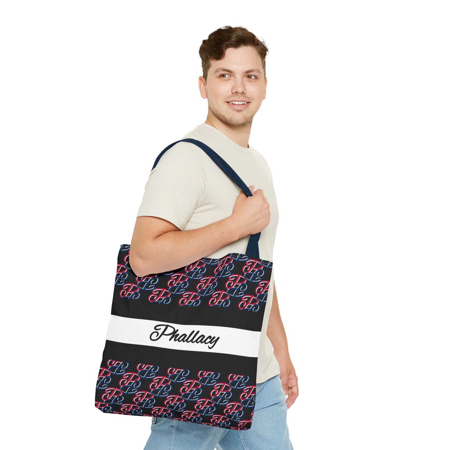 Man carrying a Phallacy designer tote bag with patterned design and Phallacy text