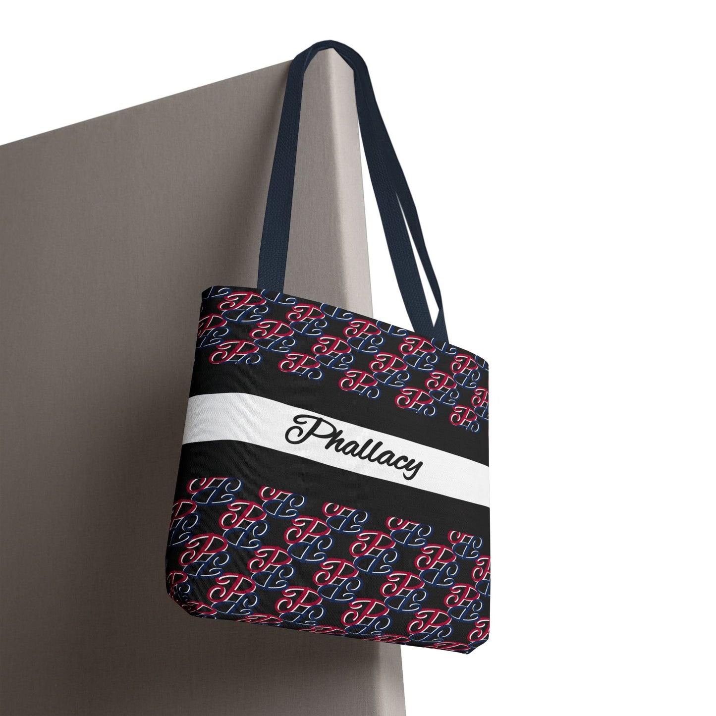 Phallacy designer tote bag with black, red, and blue pattern featuring the text Phallacy and long black straps