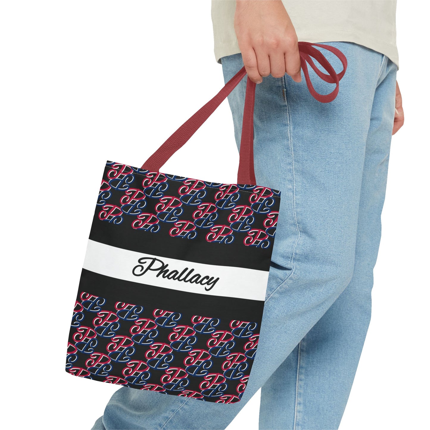 Phallacy designer tote bag with red and blue pattern and name Phallacy held by person wearing jeans
