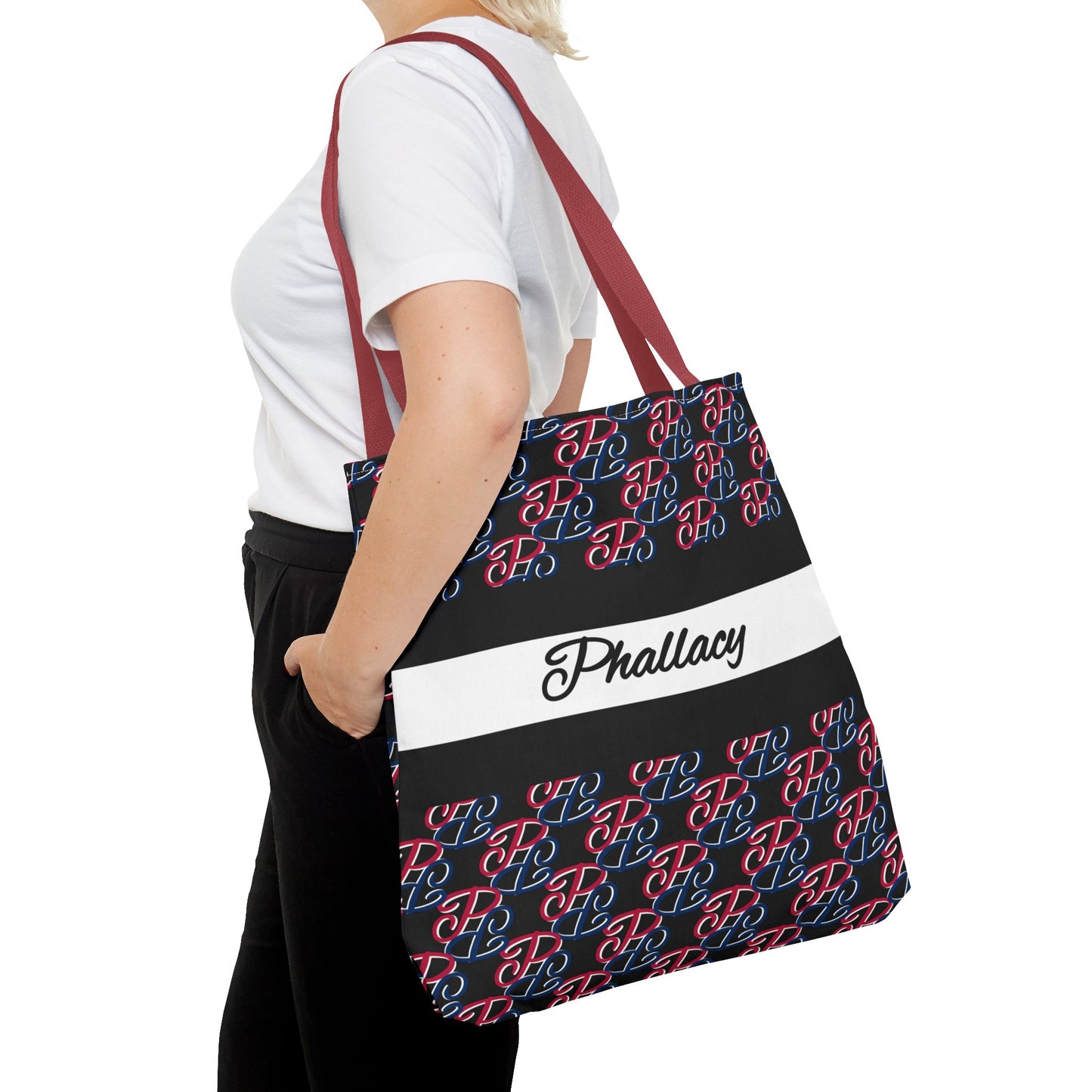 Phallacy designer tote bag with red and blue pattern and maroon straps worn over shoulder