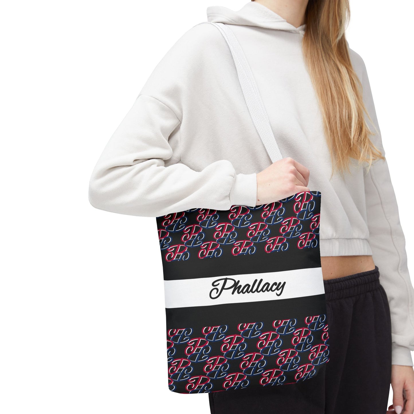 Phallacy designer tote bag with black and red pattern and Phallacy logo worn by a person in casual outfit