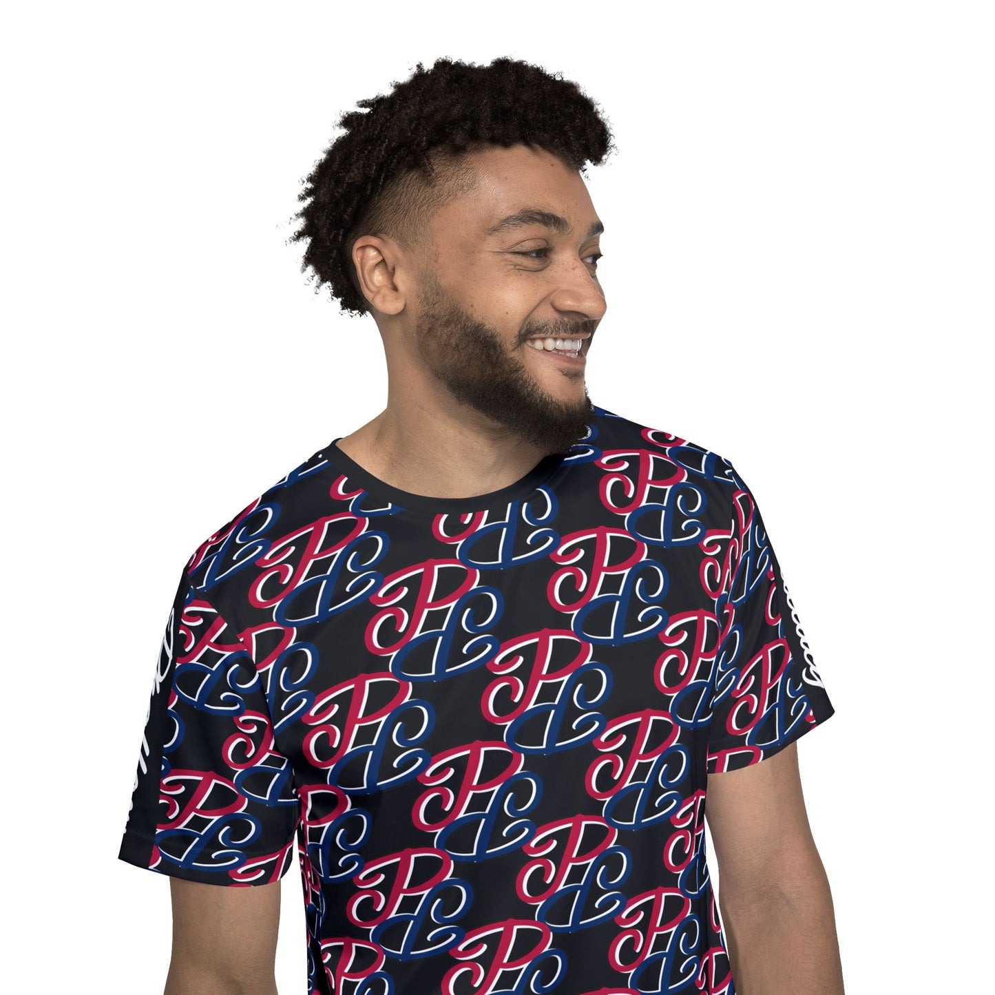 Smiling man wearing a Phallacy designer men's sports jersey with all over colorful logo prints