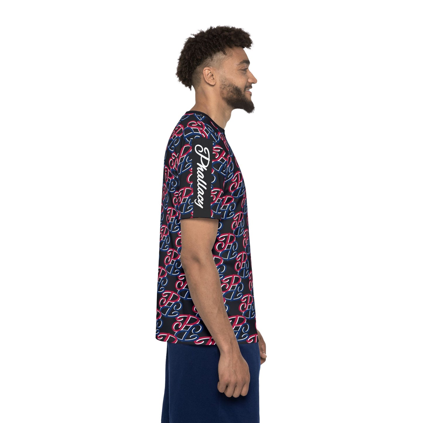 Side view of a man wearing a designer men's sports jersey with all over prints in navy and red