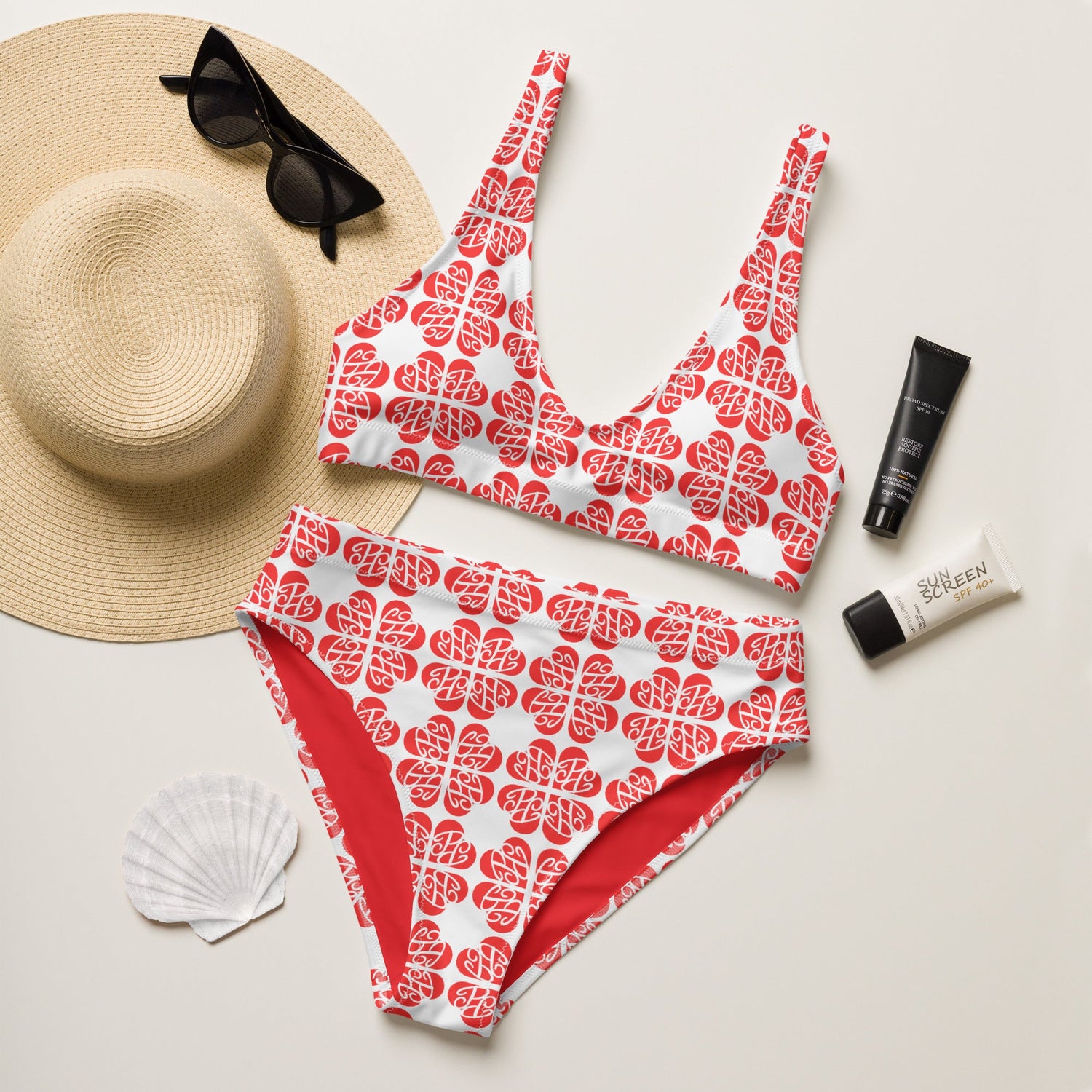Luxury designer women's swimwear featuring elegant patterns and complementary accessories for a stylish beach look