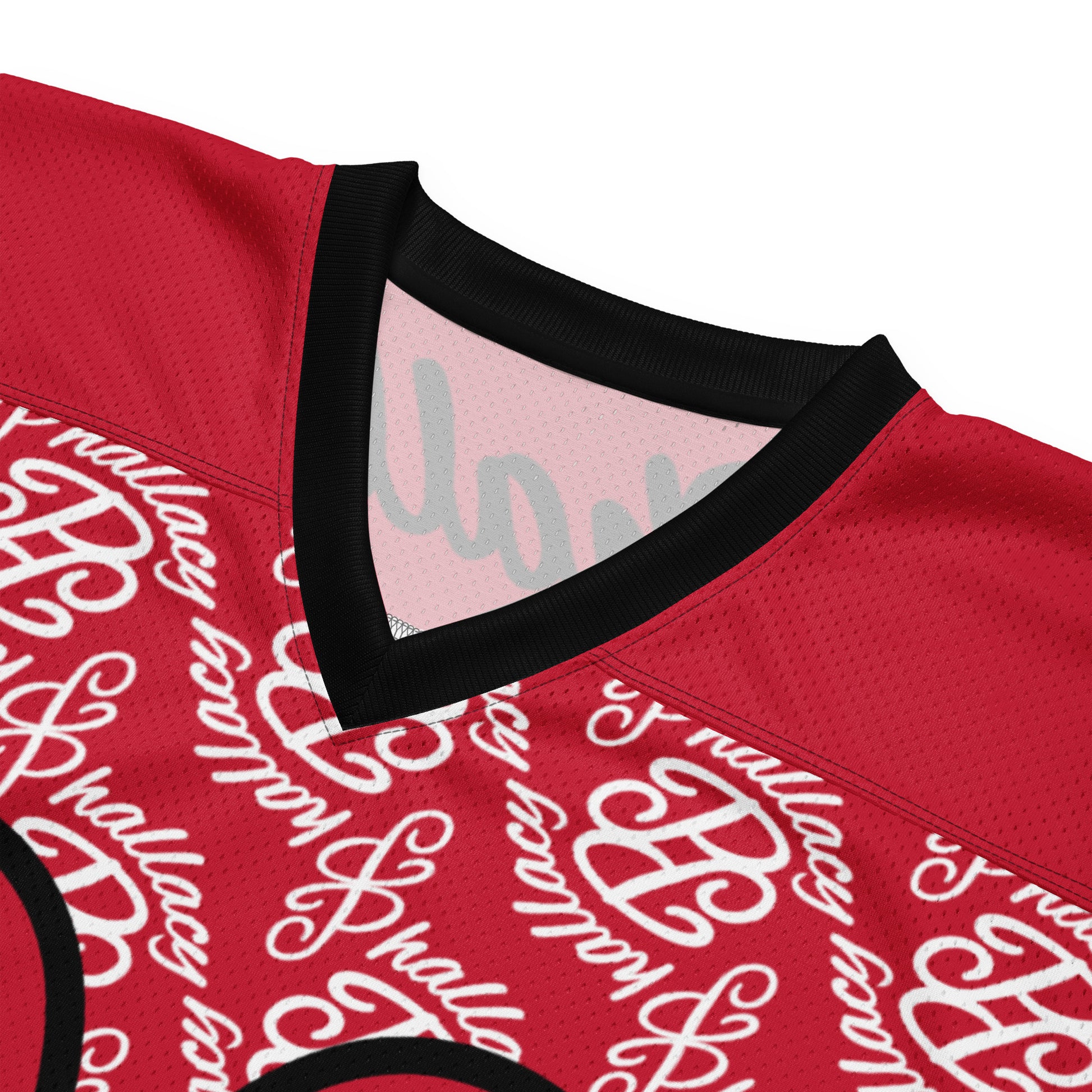 Close-up of a designer men's football jersey featuring an all over print design in vibrant red colors