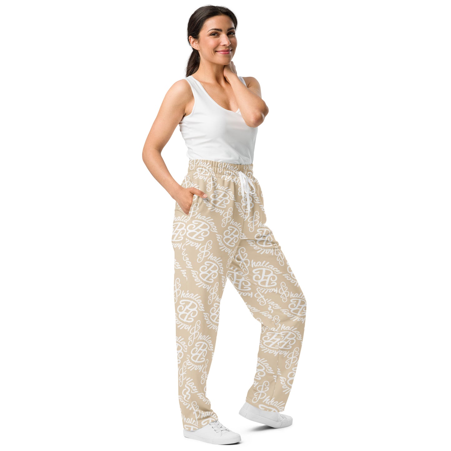Stylish model wearing designer monogram wide-leg joggers in beige with a comfortable fit