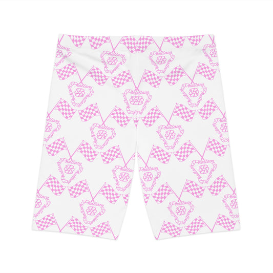 Designer women's biker shorts in pink and white checkerboard pattern with logo design