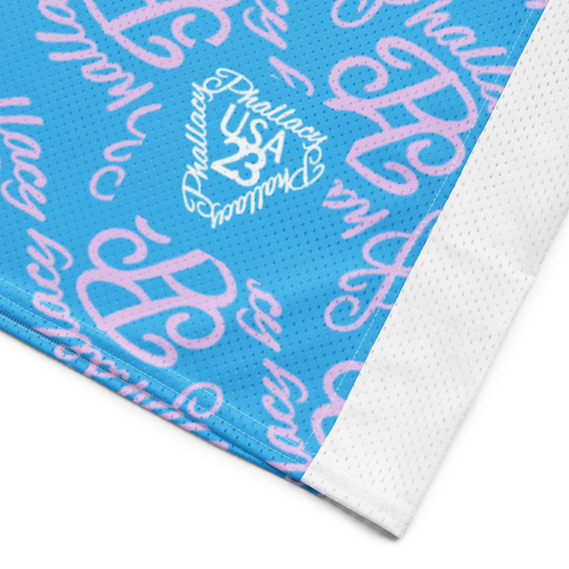 Close-up of a designer women's football jersey featuring a blue and pink all over print pattern