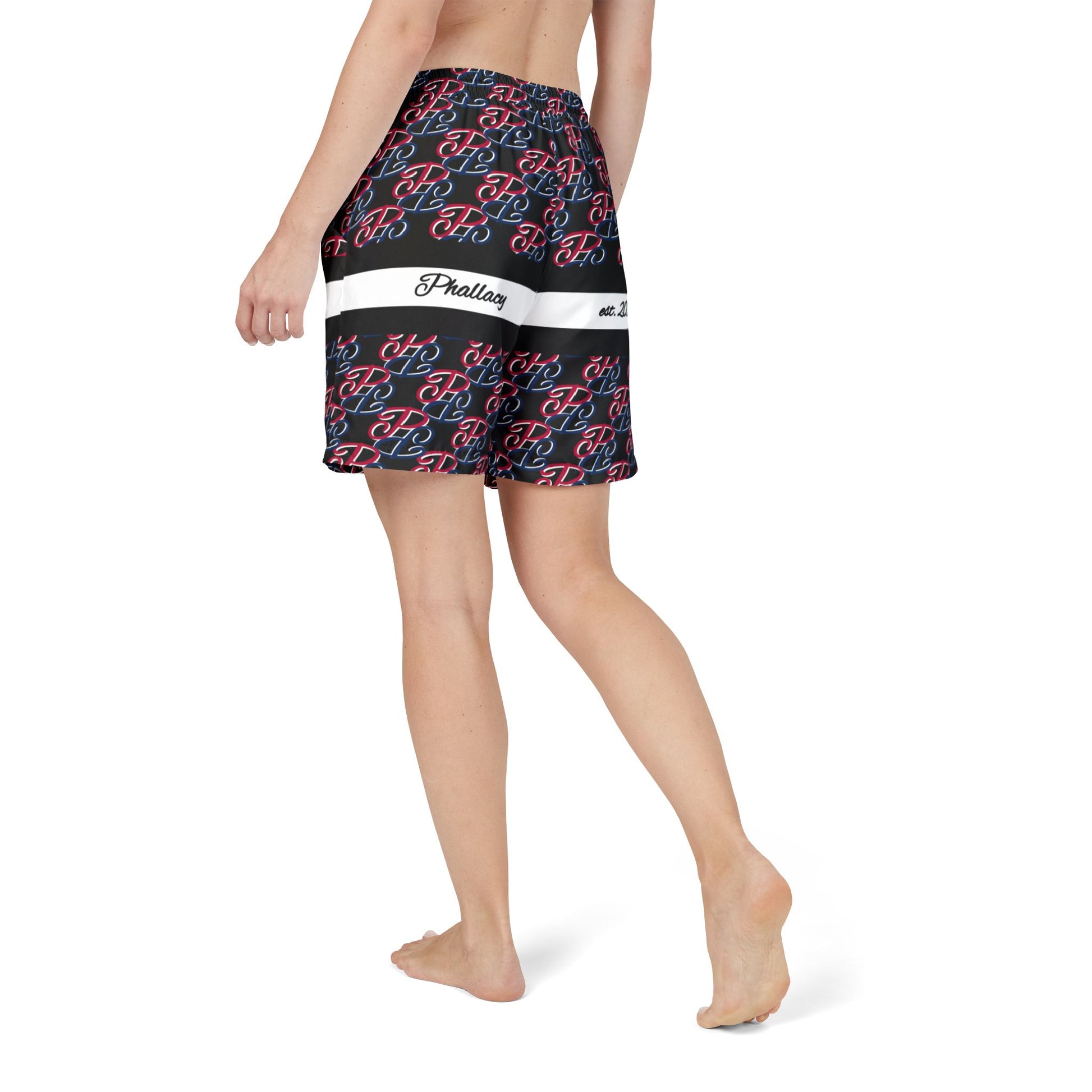 Phallacy designer unisex swim shorts featuring all over print with black, red, and white pattern on model